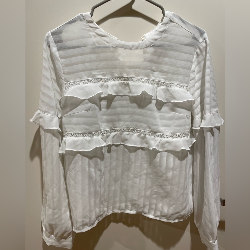 White ruffle shirt